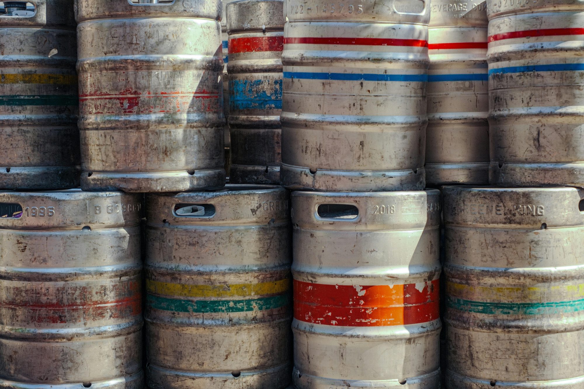 Stacked beer kegs in a craft brewery distribution warehouse